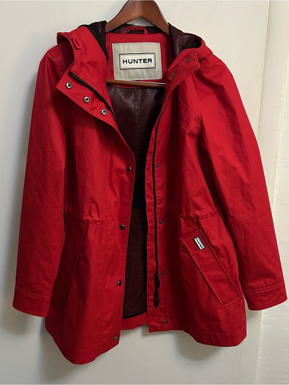 Hunter red raincoat with drawstring waist and double zipper women’s size medium